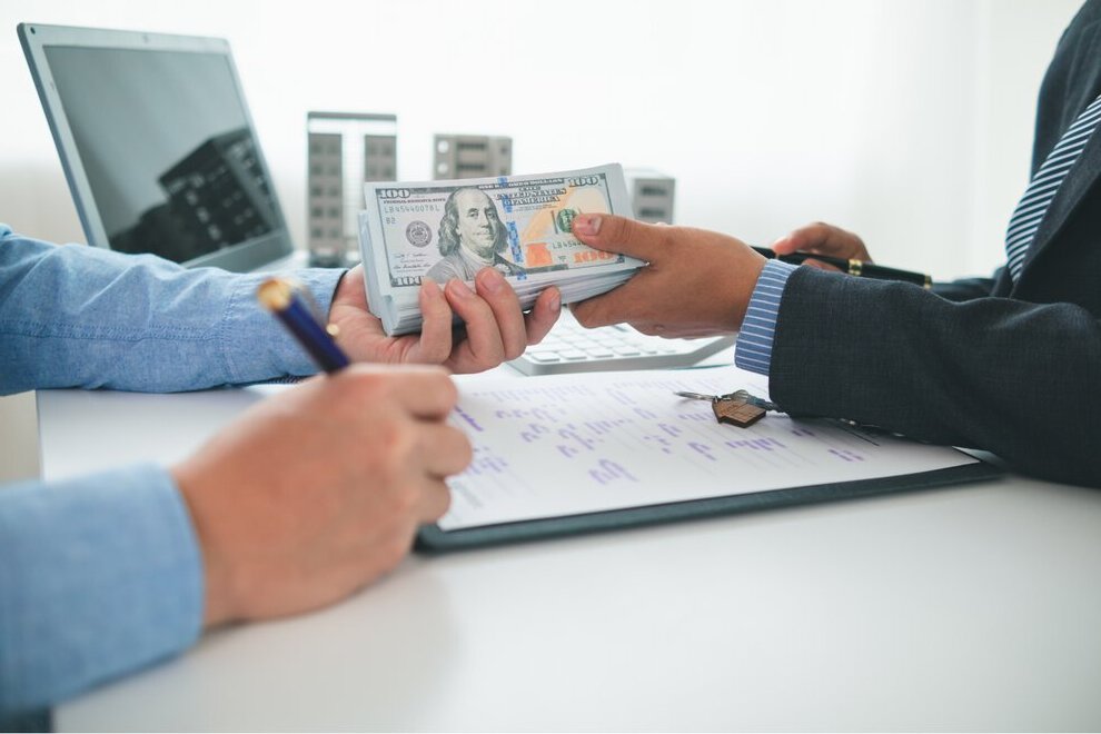 Customer payment being reviewed alongside financial documents